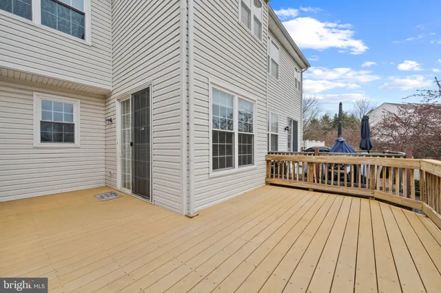 a view of a balcony with wooden floor