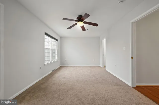 a spacious bathroom with a double vanity sink a mirror and a bathtub