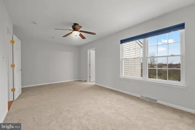a bath room with a toilet a sink and a bath tub