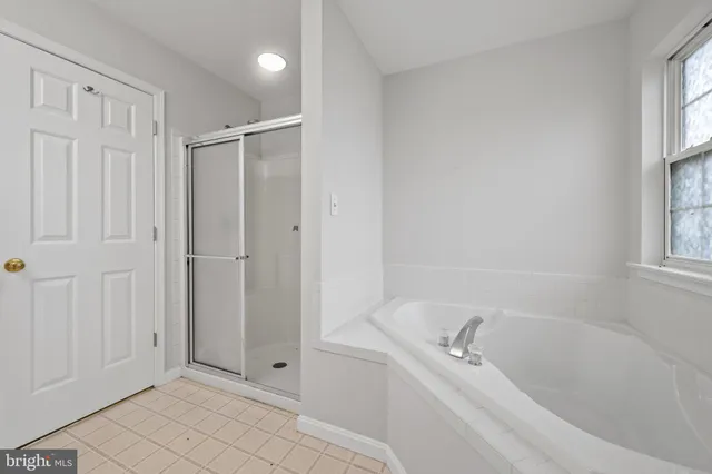 a view of a bathroom with a sink and mirror
