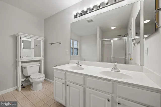 an empty room with a ceiling fan and a window