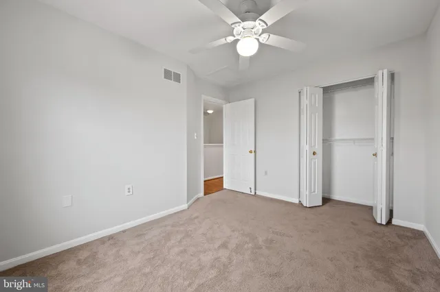 an empty room with closet area