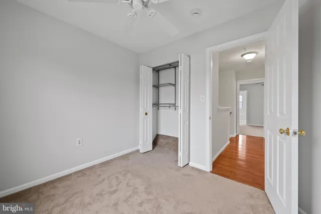 a view of an empty room with a fireplace