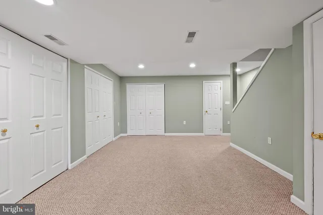 a view of front of house with a deck