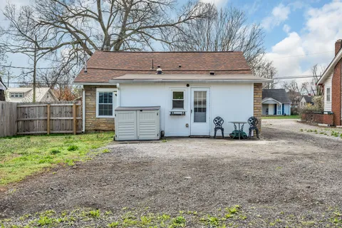 a view of a house with a yard and garage