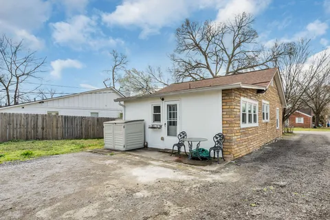 a view of a house with a yard and garage