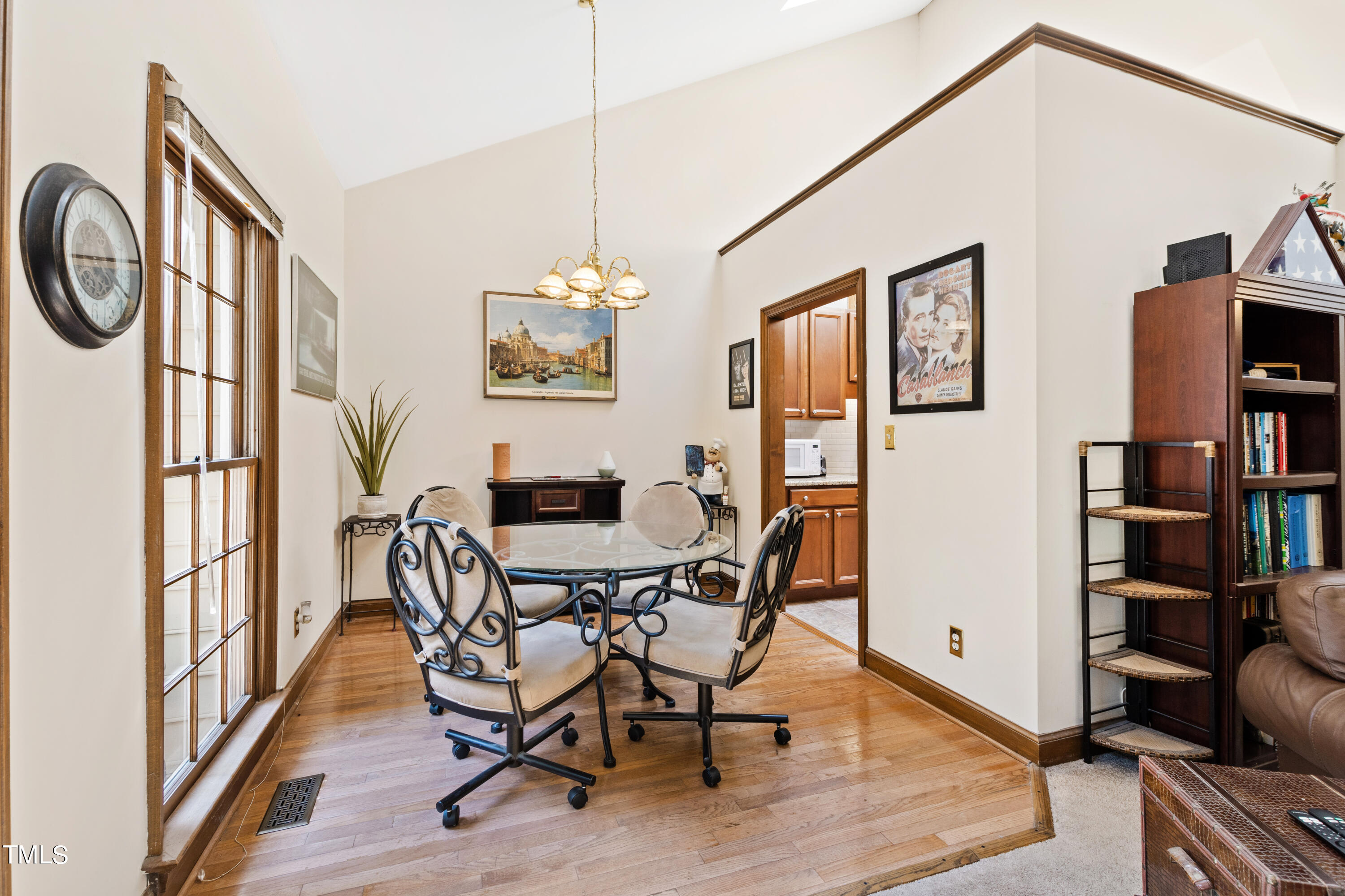 8450 Wycombe Lane Raleigh, NC 27615 - Photo 11 of 32 a view of a dining room with furniture window and wooden floor