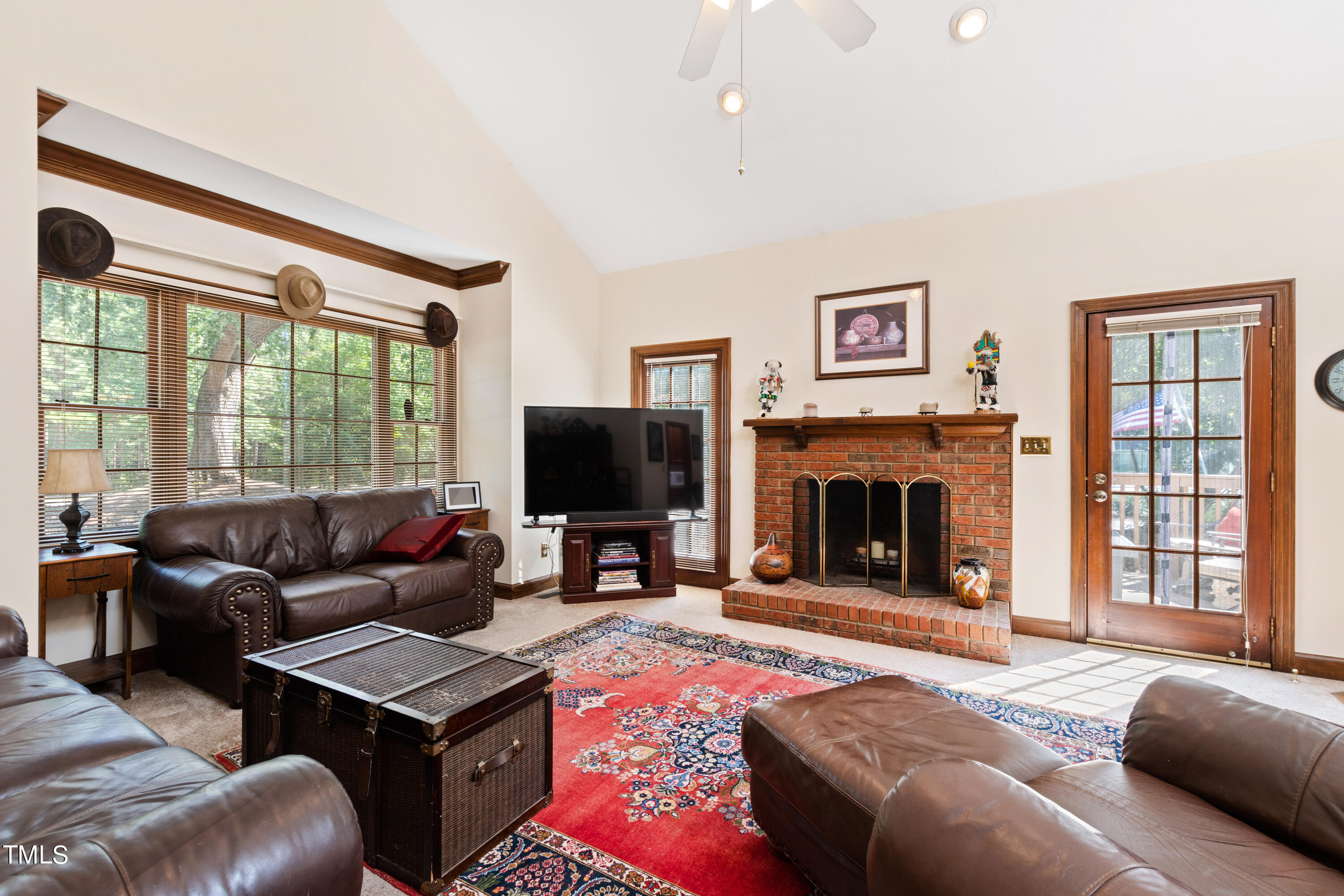 8450 Wycombe Lane Raleigh, NC 27615 - Photo 13 of 32 a living room with furniture and a flat screen tv