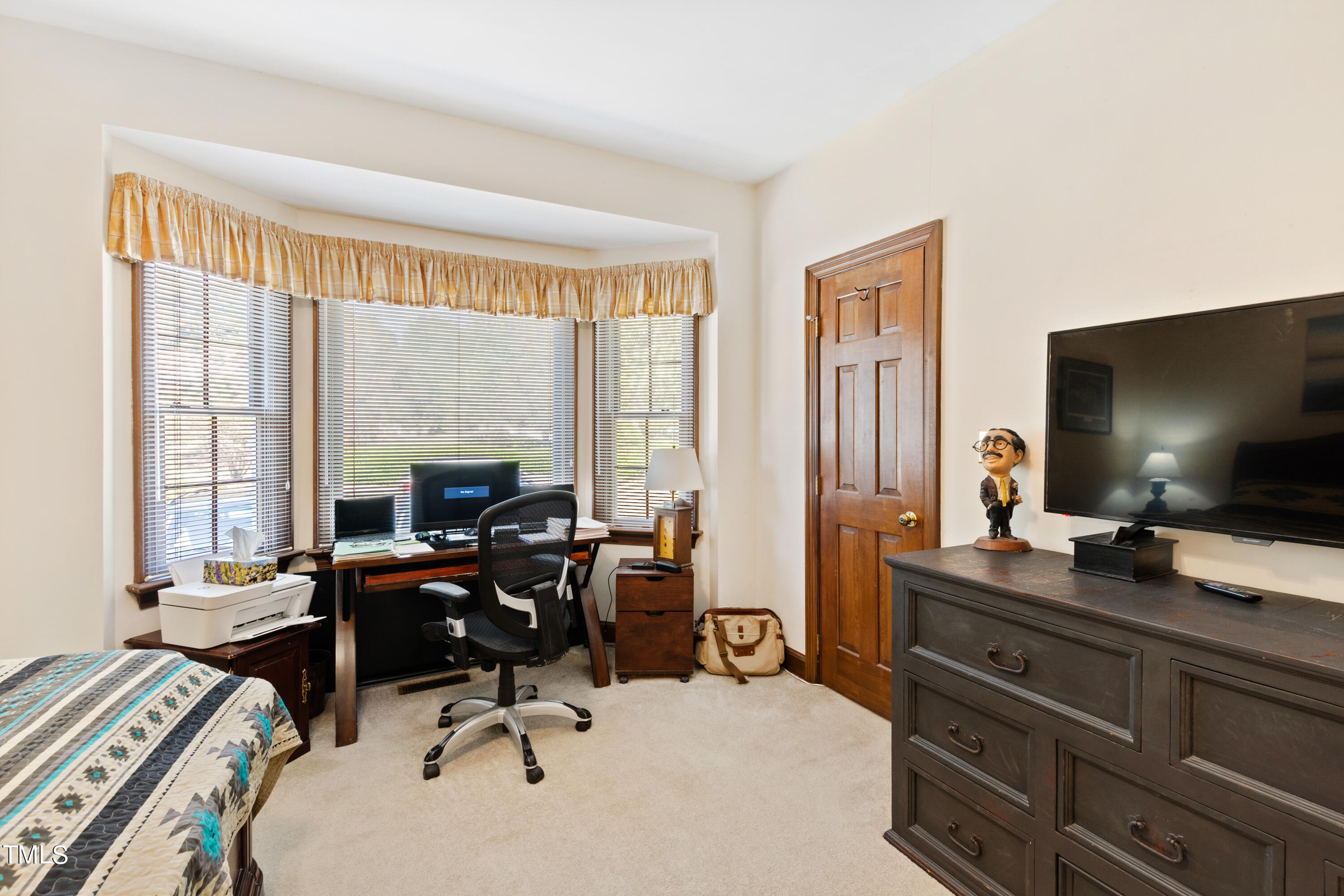 8450 Wycombe Lane Raleigh, NC 27615 - Photo 15 of 32 a view of a workspace with furniture and a window