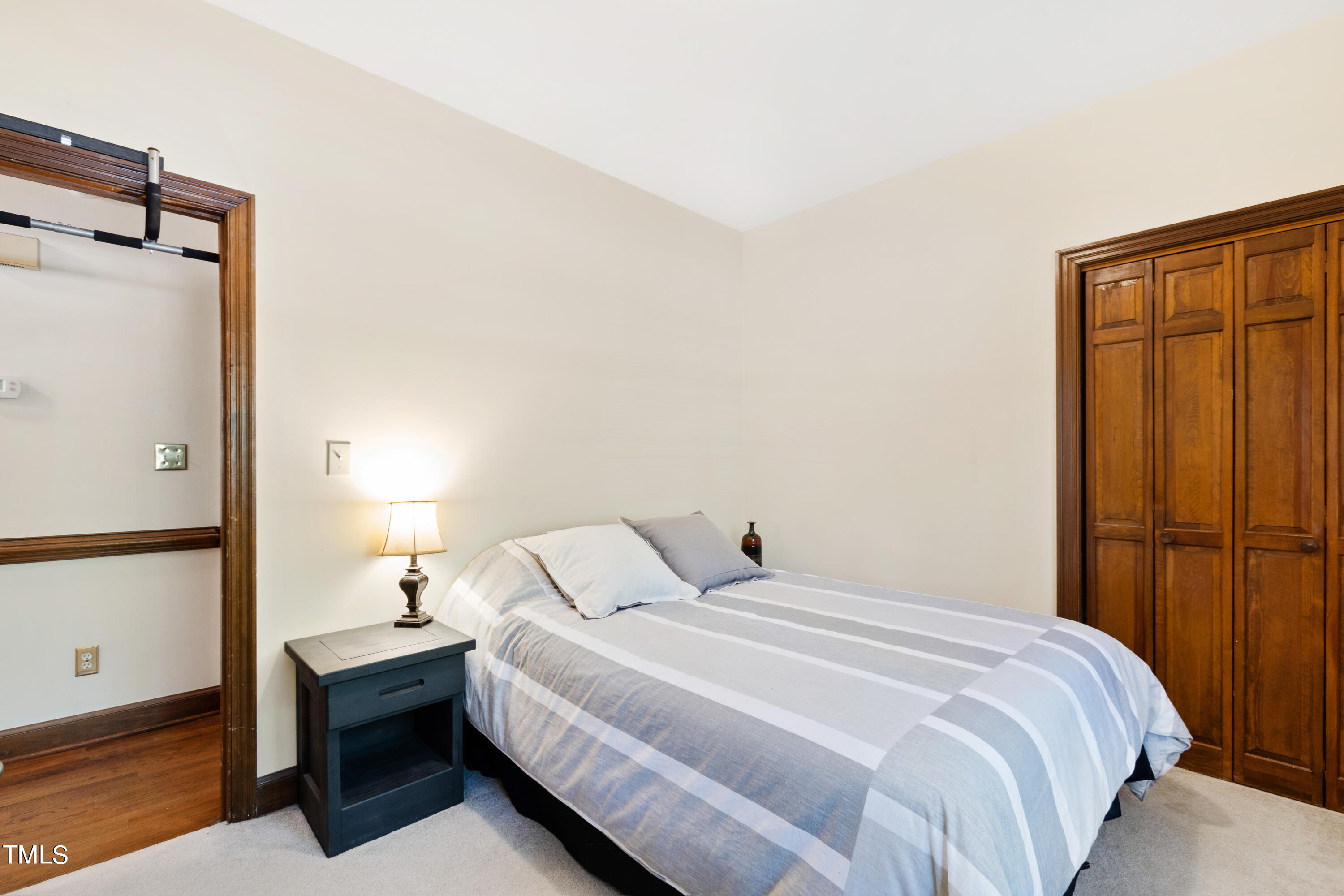 8450 Wycombe Lane Raleigh, NC 27615 - Photo 21 of 32 a bedroom with a bed and a table