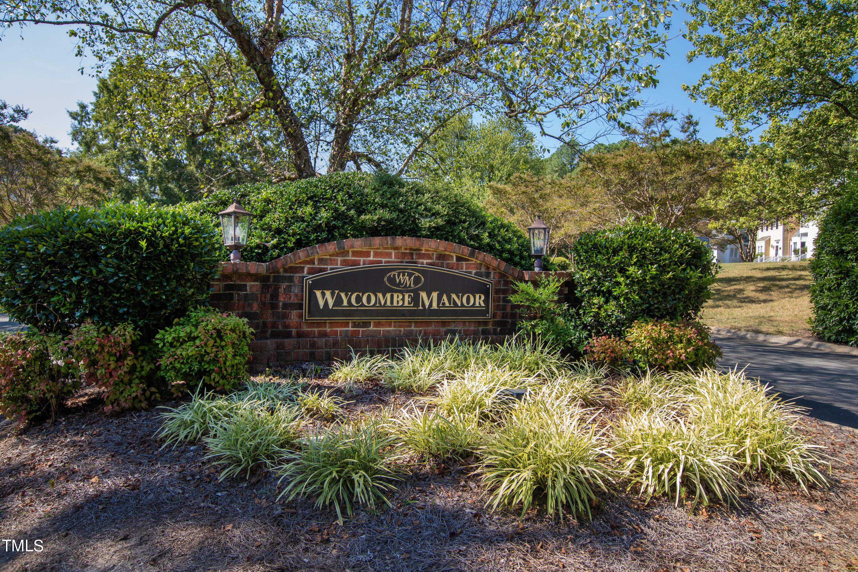 8450 Wycombe Lane Raleigh, NC 27615 - Photo 32 of 32 a sign of a garden with large trees