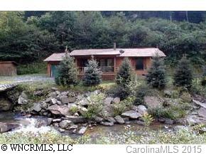 a view of a back yard with green space