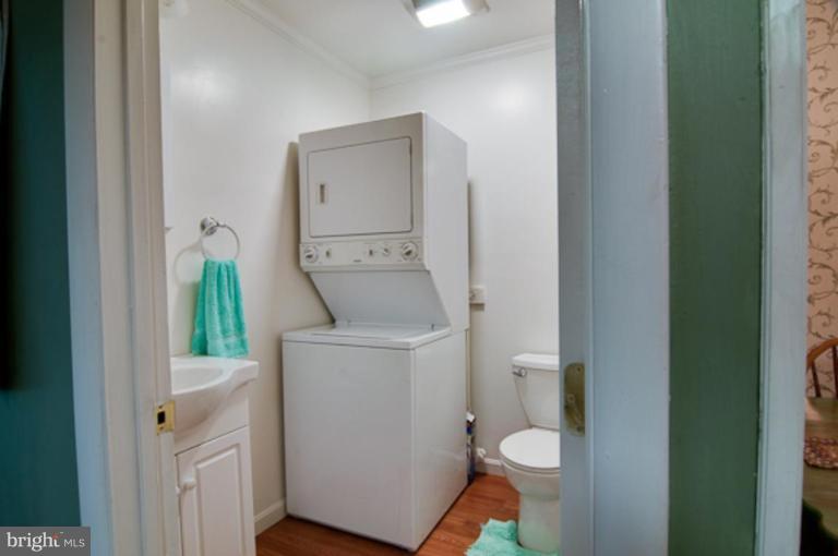 9 Research Road, Unit E Greenbelt, MD 20770 - Photo 8 of 27 Half bath on the main level.
