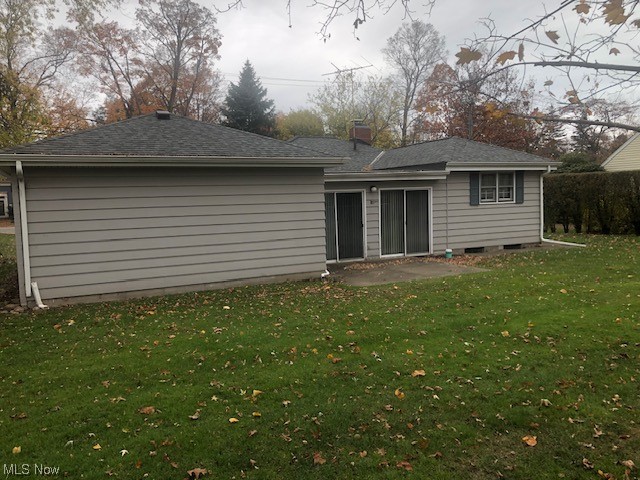7755 Garfield Road Mentor, OH 44060 - Photo 13 of 13 Rear view of house with a lawn