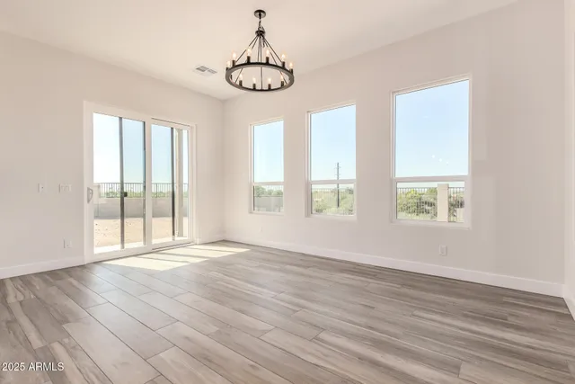 a large kitchen with kitchen island a sink stainless steel appliances and cabinets