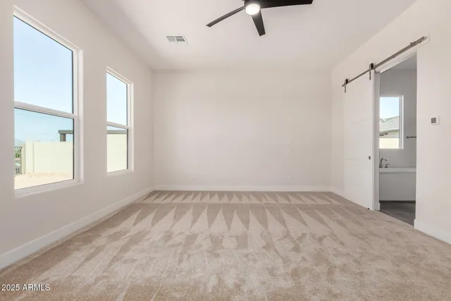 a bathroom with a granite countertop sink mirror and a bathtub