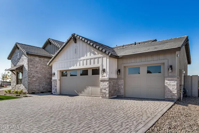 a front view of a house with a garage