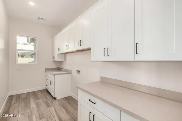 a view of a dry yard with palm trees