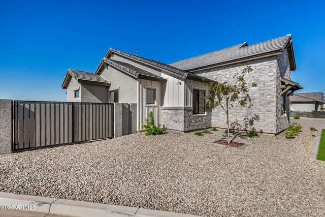 a view of a house with wooden floor and a bench