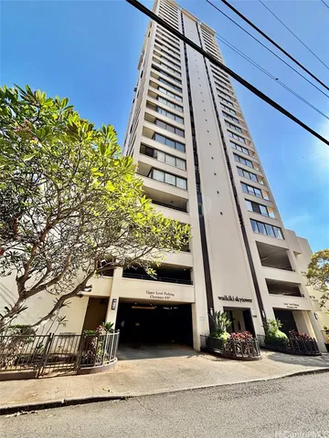 a living room with a fireplace a flat screen tv and potted plant