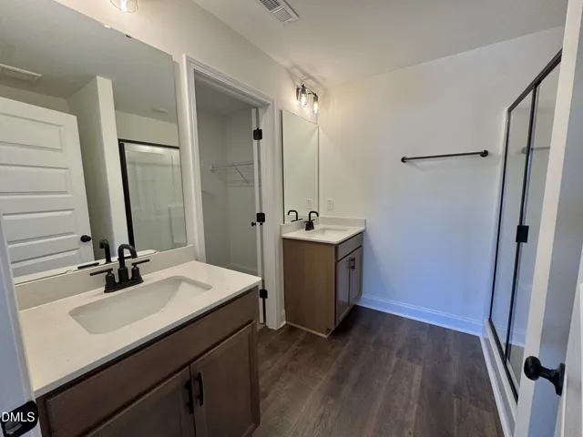 a bathroom with a sink a toilet a mirror and vanity