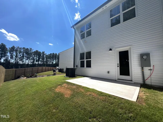 a view of a backyard of the house