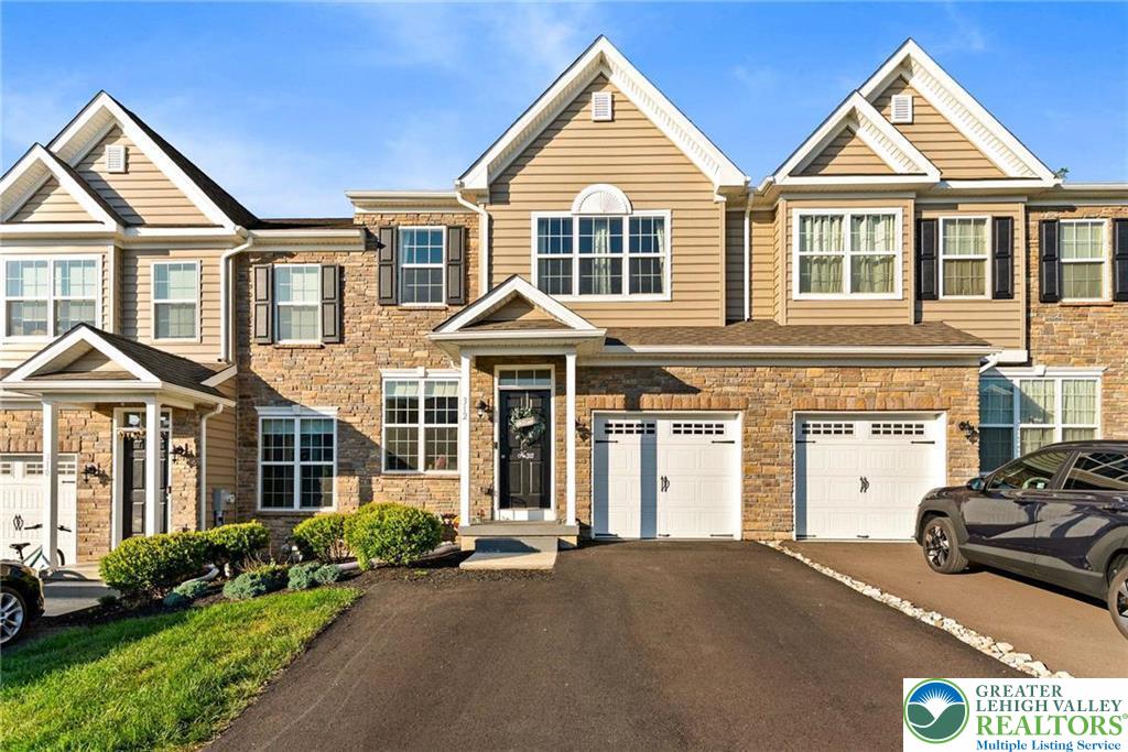 312 Redclover Lane Allentown, PA 18104 - Photo 1 of 60 a view of a white house with a large windows and a yard