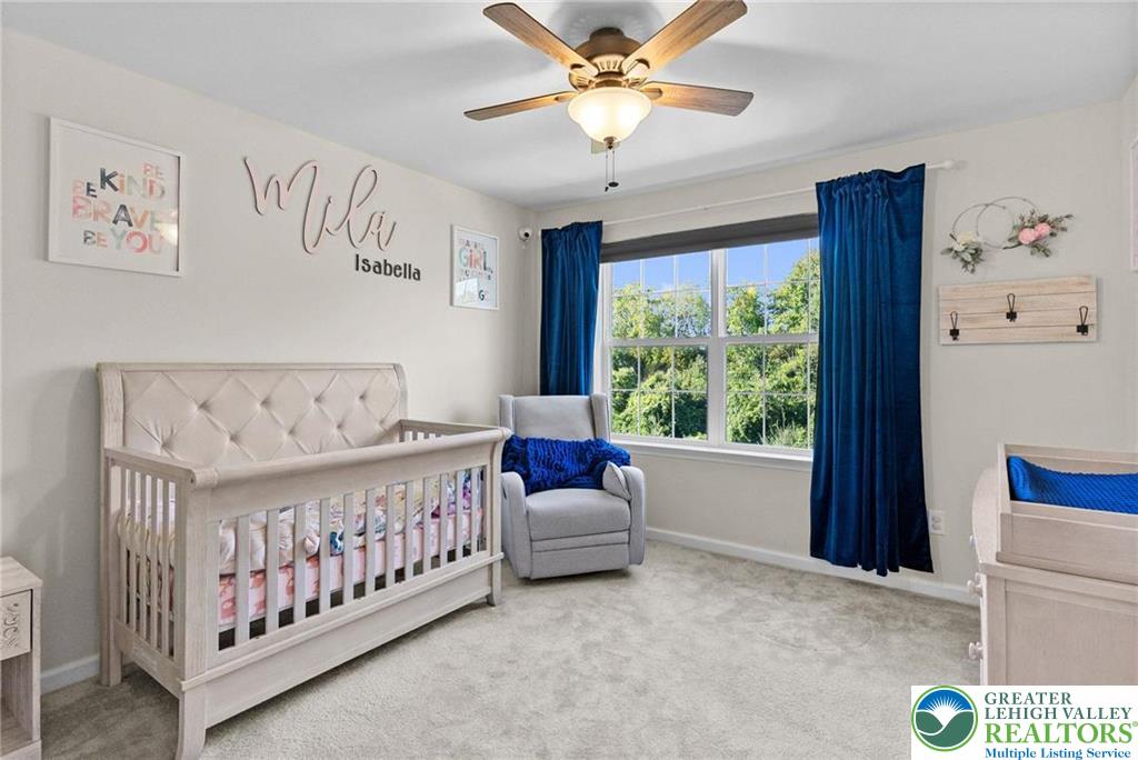 312 Redclover Lane Allentown, PA 18104 - Photo 21 of 60 a bedroom with a bed and a large window