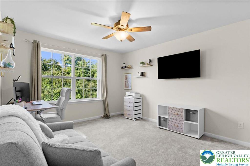 312 Redclover Lane Allentown, PA 18104 - Photo 23 of 60 a living room with furniture and a flat screen tv
