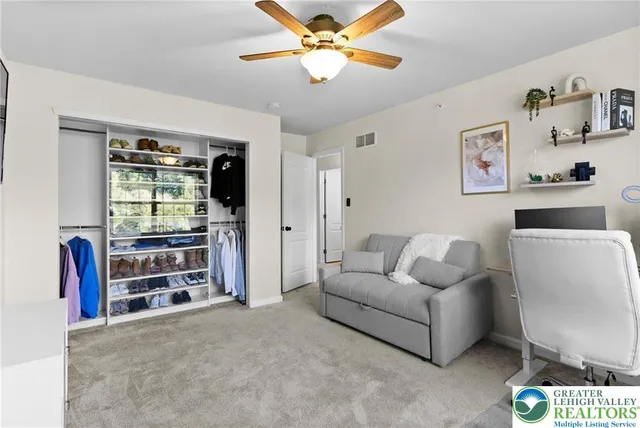 a bathroom with a sink a toilet and shower curtain