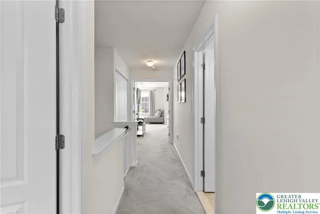 a view of a hallway with washer and dryer