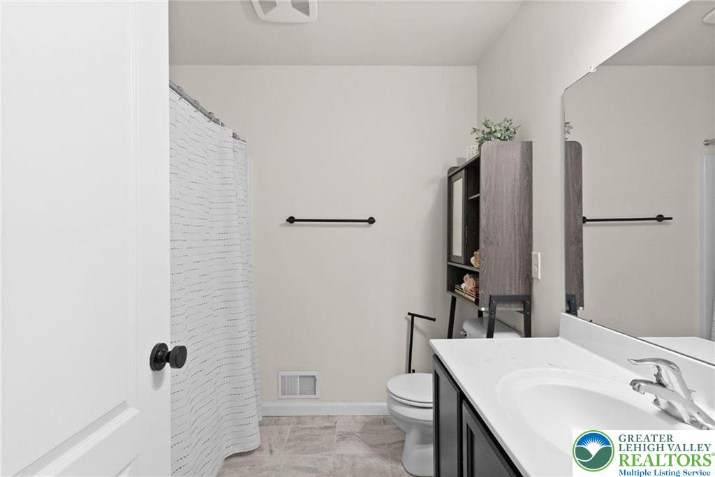 312 Redclover Lane Allentown, PA 18104 - Photo 26 of 60 a bathroom with a sink a toilet and shower