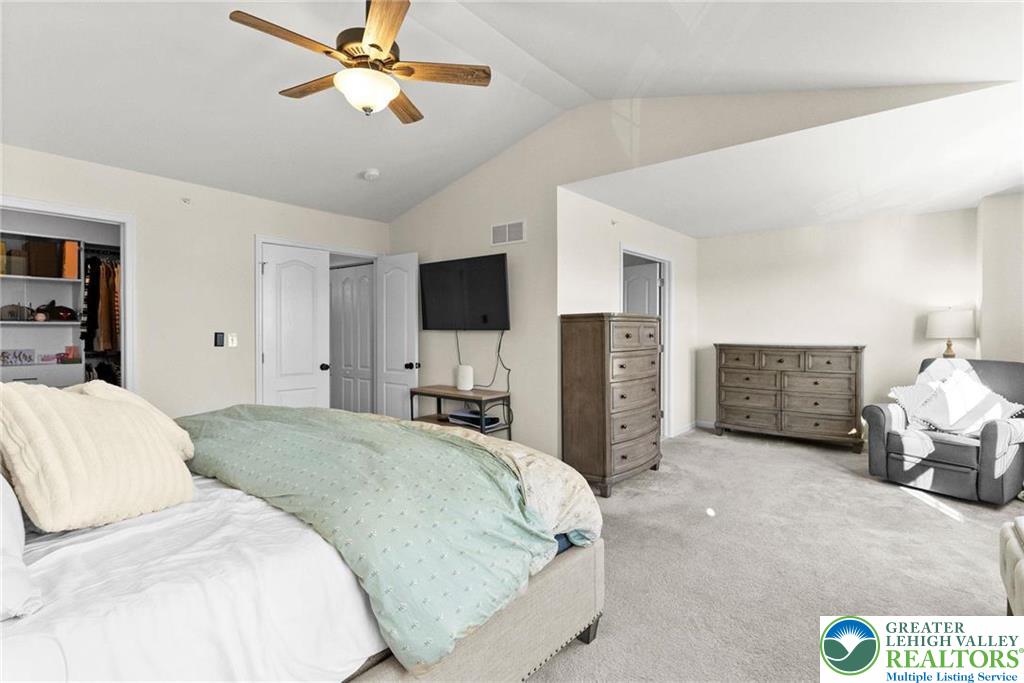 312 Redclover Lane Allentown, PA 18104 - Photo 32 of 60 a spacious bedroom with a bed and a flat tv screen