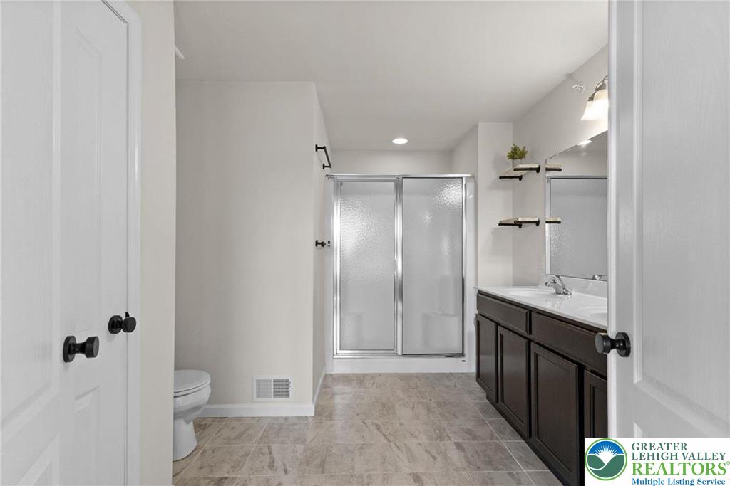 312 Redclover Lane Allentown, PA 18104 - Photo 38 of 60 a bathroom with a sink and mirror