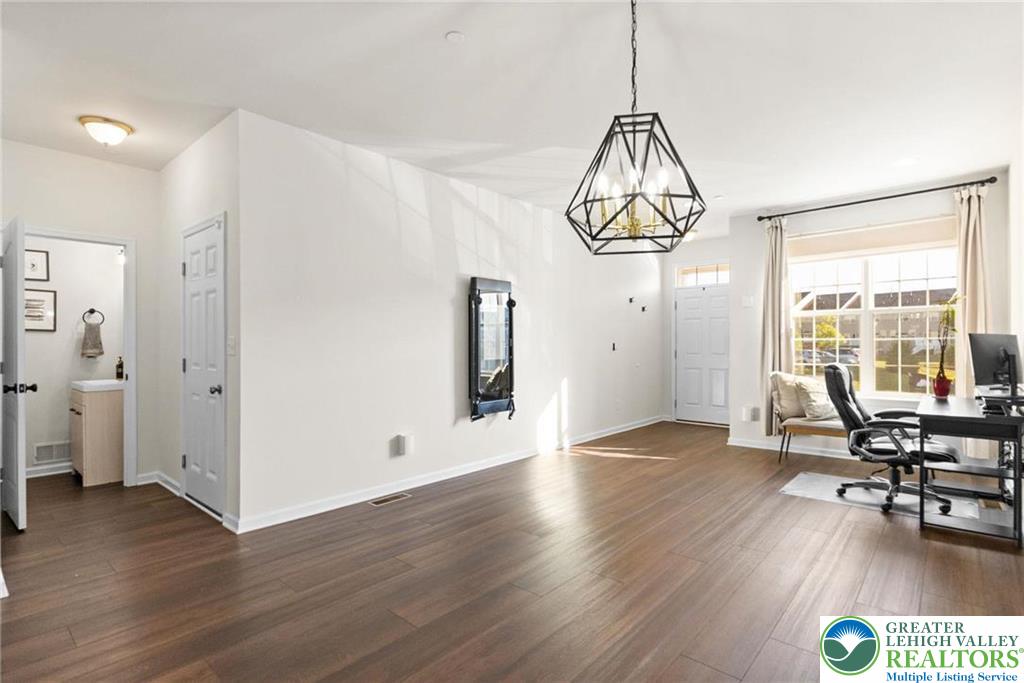 312 Redclover Lane Allentown, PA 18104 - Photo 5 of 60 a view of a room with wooden floor mirror and windows