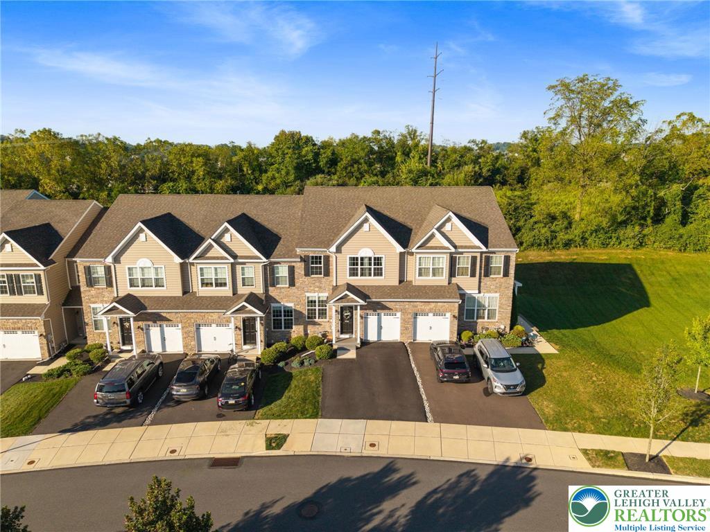 312 Redclover Lane Allentown, PA 18104 - Photo 54 of 60 a view of a white house with a big yard and large trees