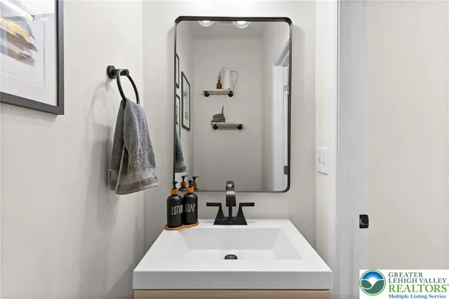 a kitchen with stainless steel appliances granite countertop a stove a sink a microwave a center island and cabinets