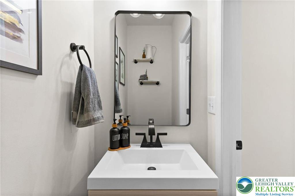312 Redclover Lane Allentown, PA 18104 - Photo 7 of 60 a bathroom with a sink and mirror