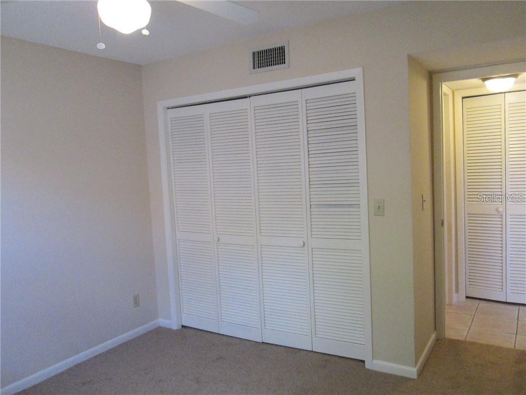 14873 Feather Cove Road Clearwater, FL 33762 - Photo 14 of 25 an empty room with closet area
