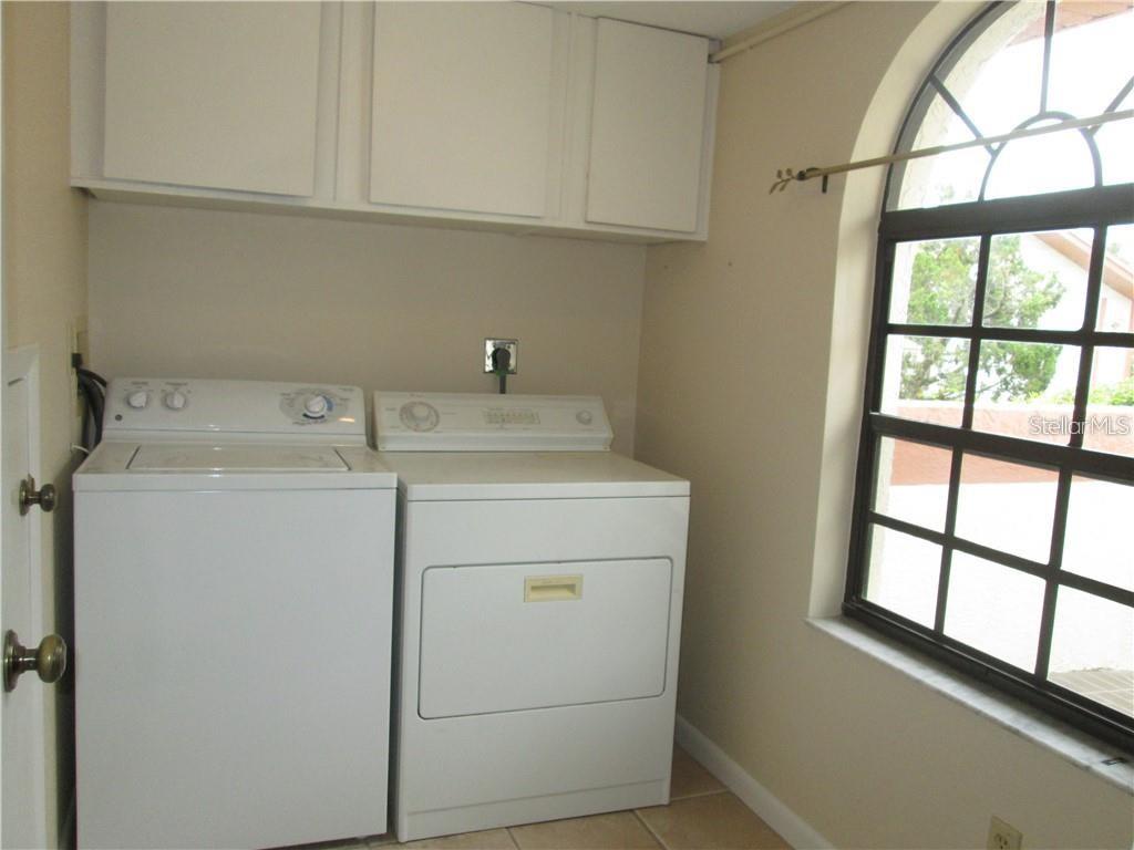 14873 Feather Cove Road Clearwater, FL 33762 - Photo 16 of 25 a utility room with dryer and washer