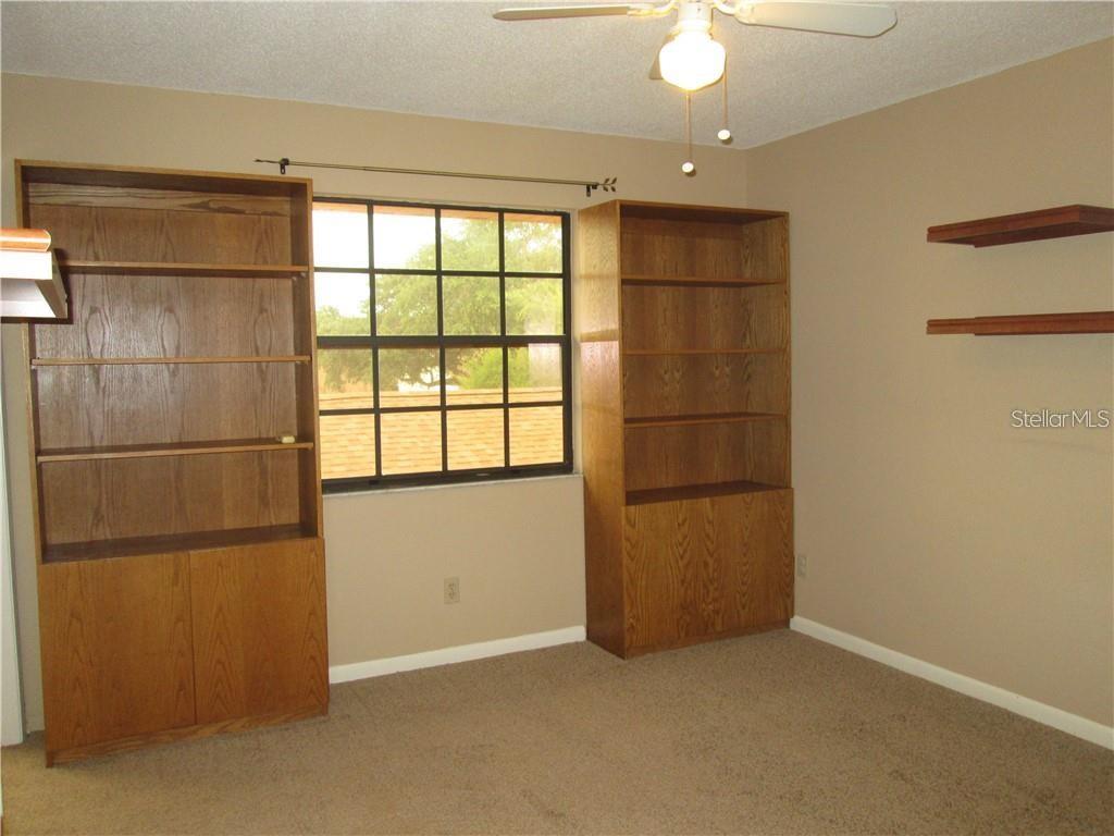 14873 Feather Cove Road Clearwater, FL 33762 - Photo 17 of 25 a view of an empty room with a window