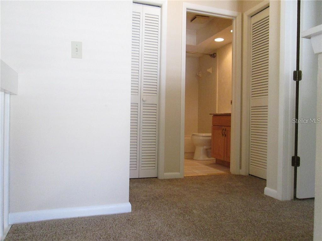 14873 Feather Cove Road Clearwater, FL 33762 - Photo 18 of 25 an empty room with a bathroom and a bathroom