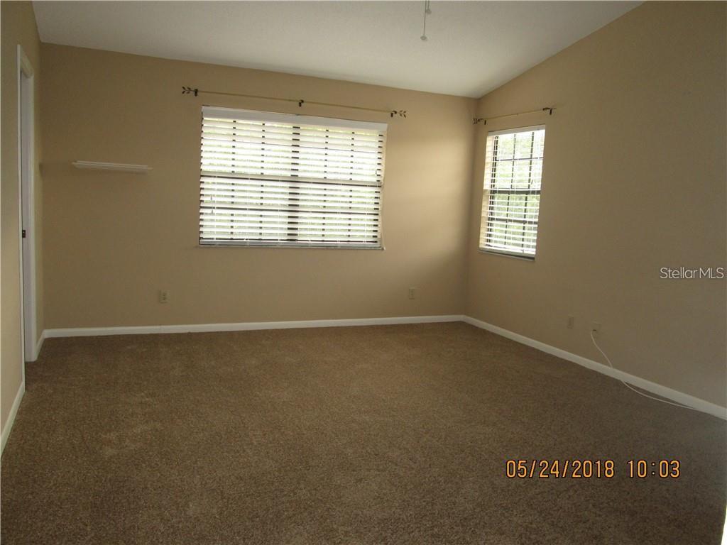 14873 Feather Cove Road Clearwater, FL 33762 - Photo 19 of 25 an empty room with a window