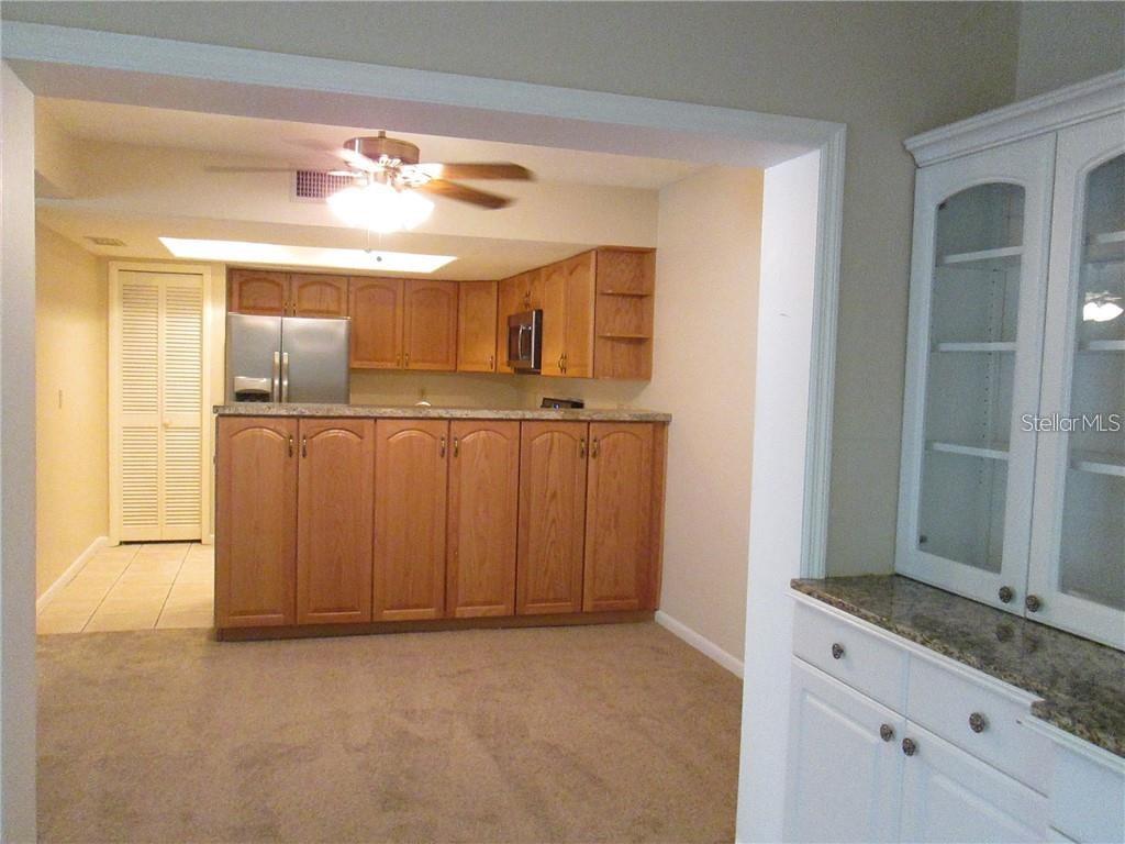 14873 Feather Cove Road Clearwater, FL 33762 - Photo 7 of 25 a view of a kitchen with a sink and dishwasher