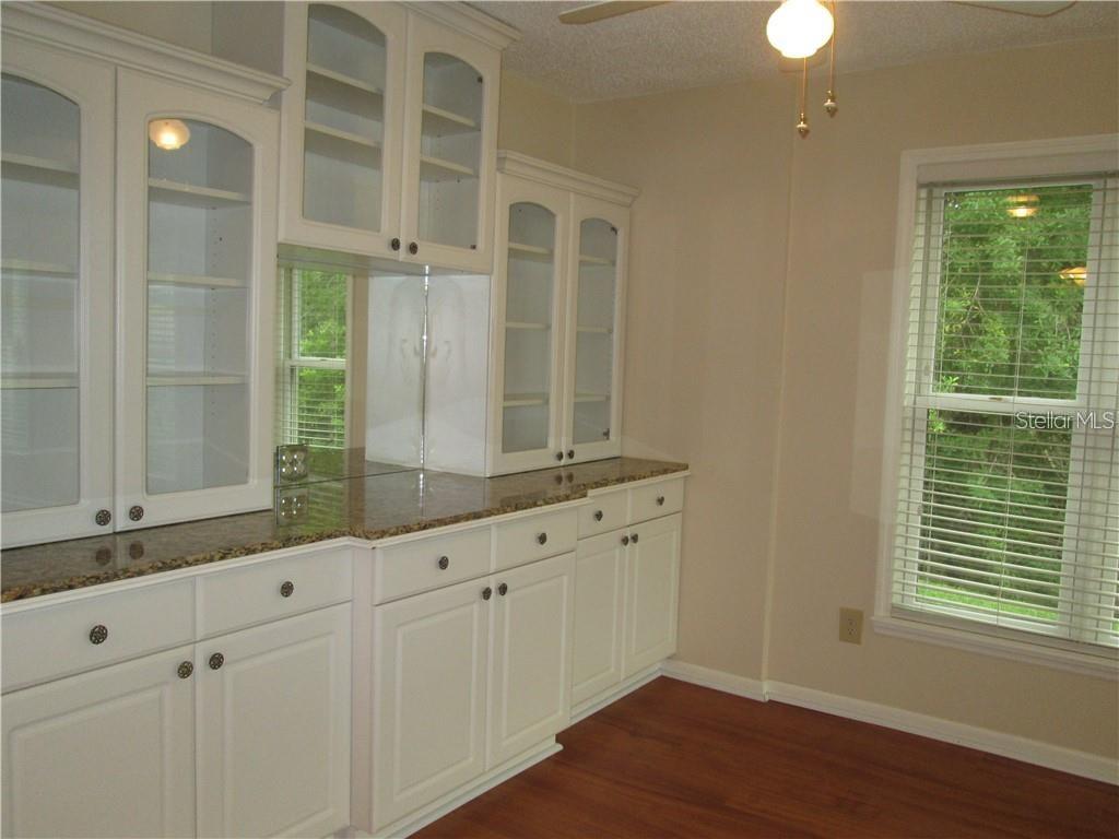 14873 Feather Cove Road Clearwater, FL 33762 - Photo 10 of 25 a bathroom with a double vanity sink and a window
