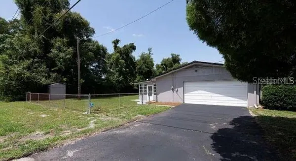 a view of backyard with green space