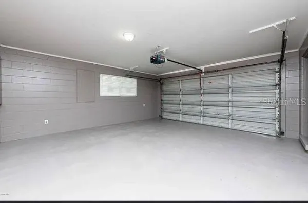 a view of room that has a bench in it