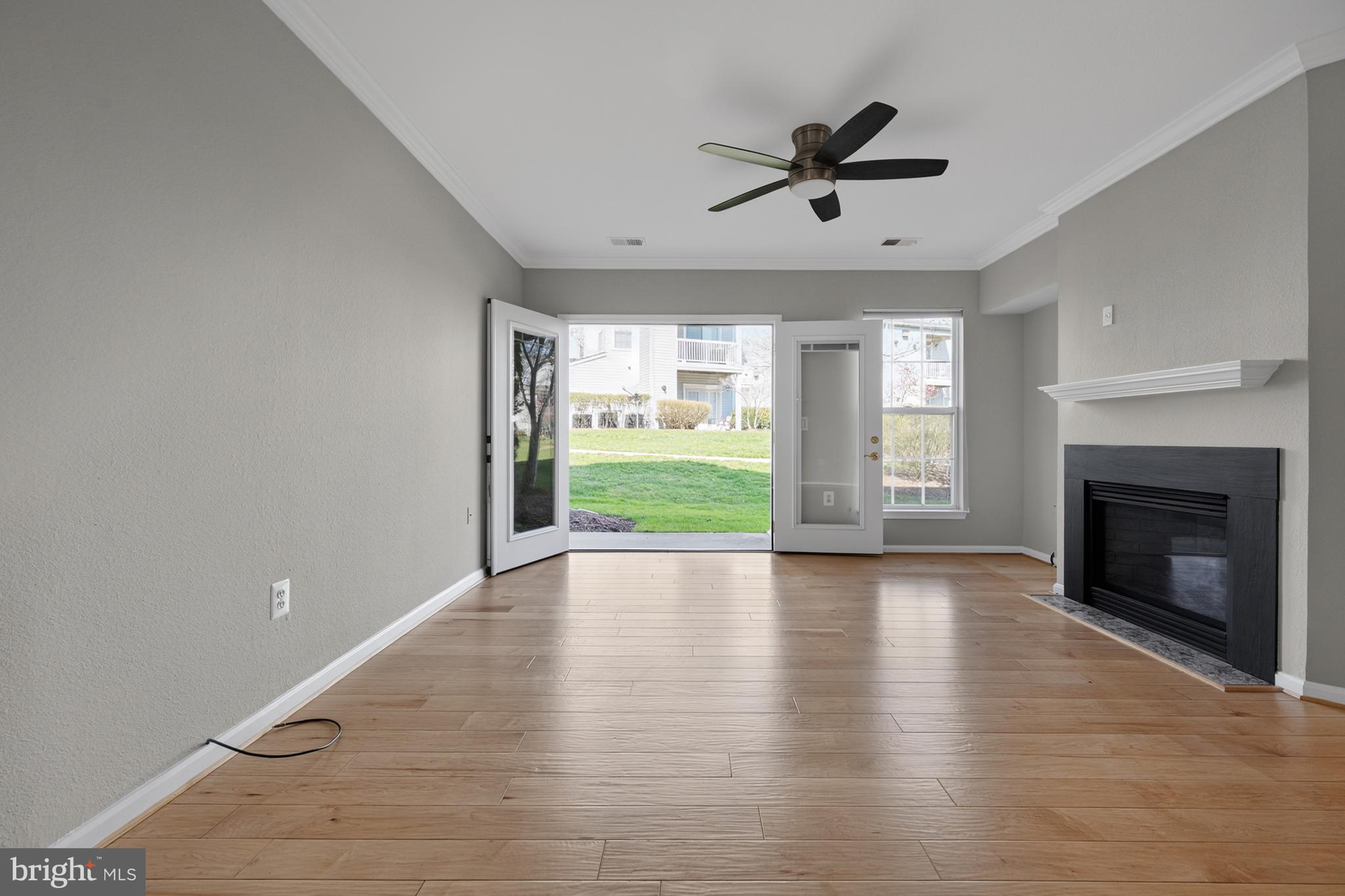 13048 Cabin Creek Road, Unit 13048 Herndon, VA 20171 - Photo 16 of 54 LIVING ROOM TO PATIO
