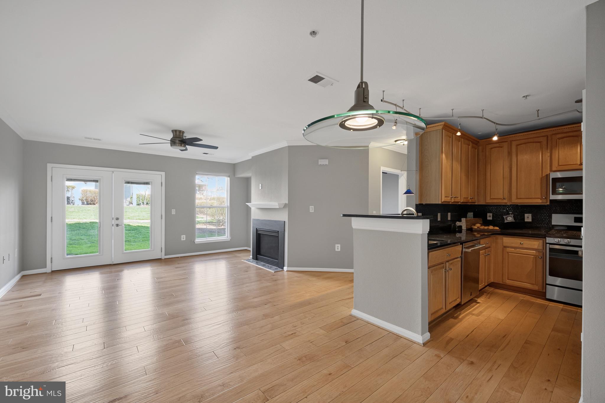 13048 Cabin Creek Road, Unit 13048 Herndon, VA 20171 - Photo 21 of 54 KITCHEN TO LIVING ROOM