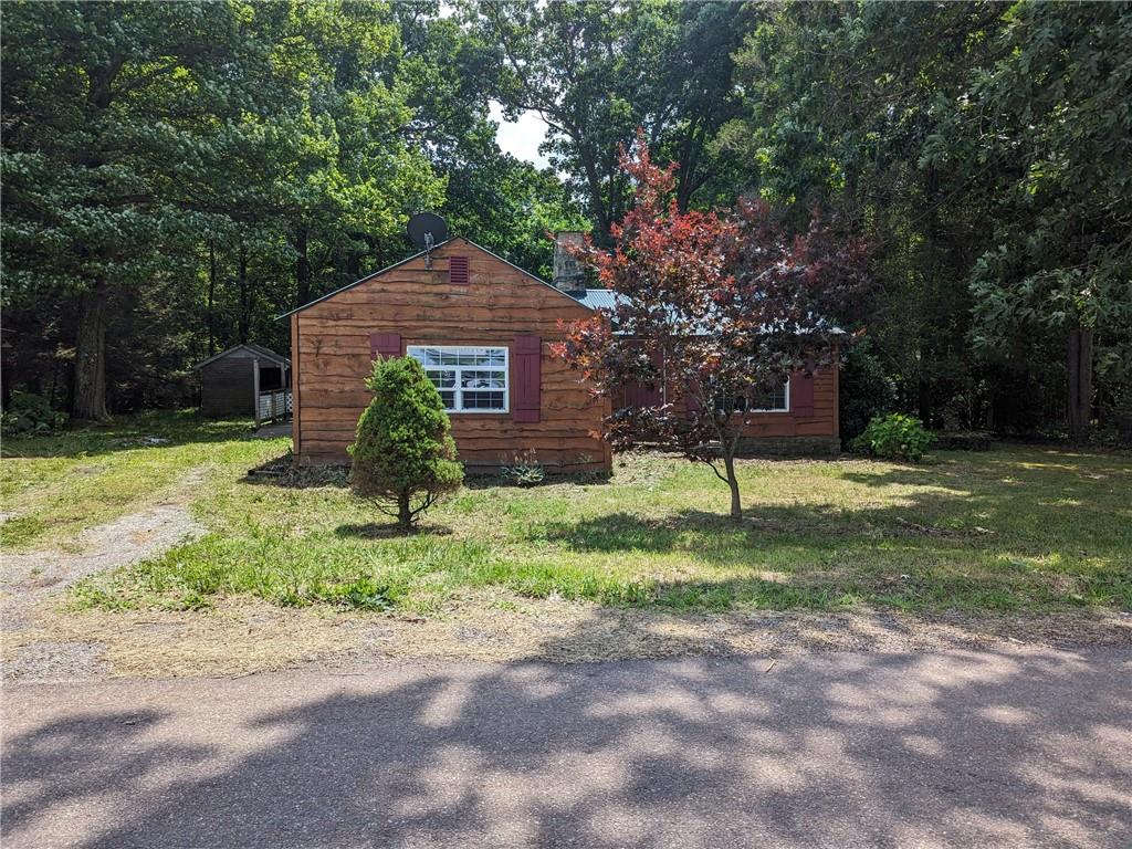 2041 Dinner Bell - 5 Forks Road Farmington, PA 15437 - Photo 1 of 10 a view of a house with backyard and a tree